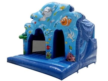 Ocean-themed bouncy castle with underwater designs, featuring dolphins and fish. Perfect for kids' parties. Buy online in Canada today!